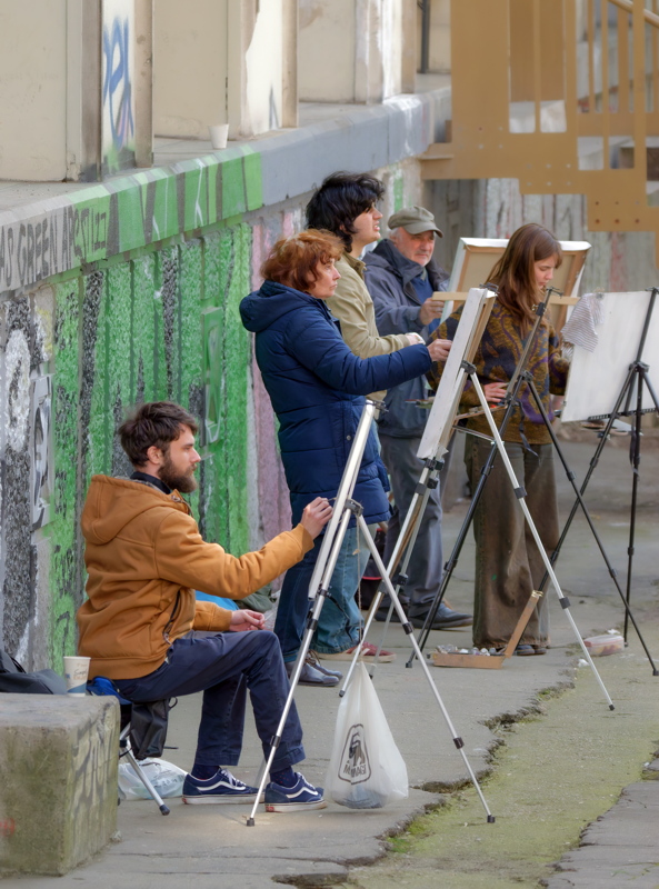 Group of people exercising painting outdoors